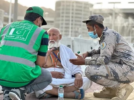 Volunteers helping pilgrims